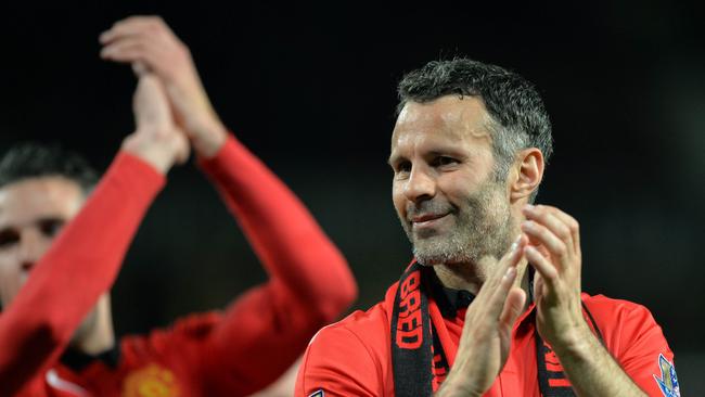 Manchester United's Interim Welsh player-manager Ryan Giggs applauds the supporters.