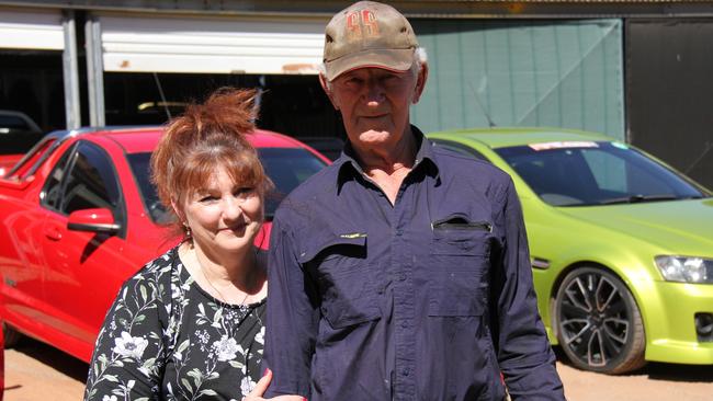 Steve and Shauna Hartig with some of the Holden utes which will be showcased at the upcoming Red CentreNATS at the end of August and start of September 2024. Picture: Gera Kazakov