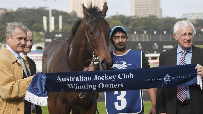 Owners Les Samba (left) and Ron Medich pose for a photograph after Winter King wins at Randwick in 2010. The pair owned at least a dozen racehorses. Picture: Martin King