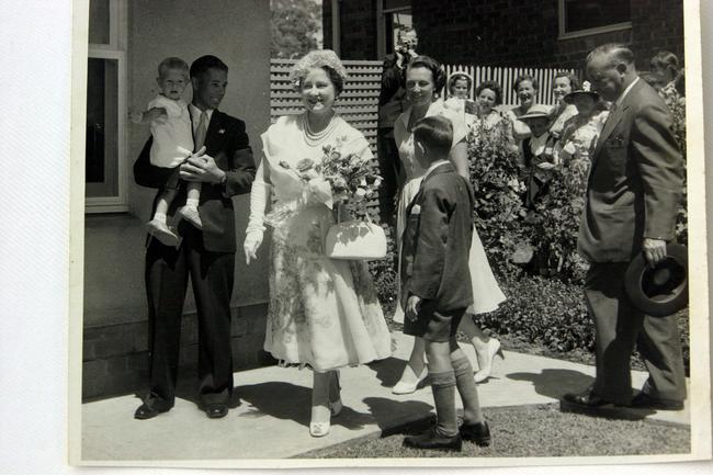 Copy photo of Queen Elizabeth, the Queen Mother (2nd from L) during a visit to Reg &amp; Betty Chard's home in Villawood, Sydney, during their tour of Australia in 1958. Picture: Char/Fam Fayl/fam Historical Royals