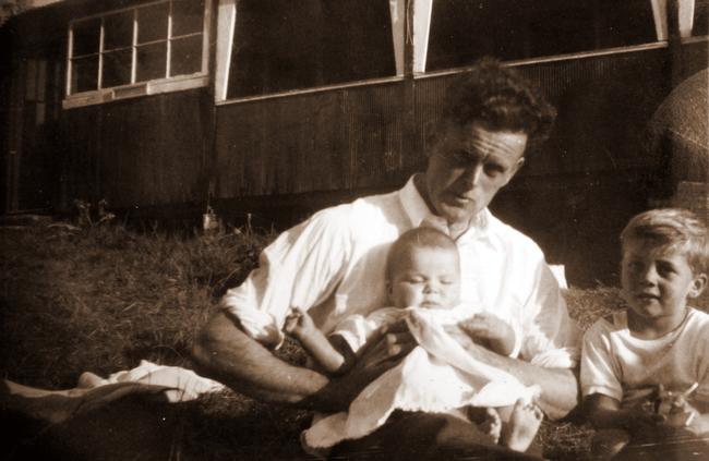 Family man Richard Howard, who was found drowned off North Narrabeen Beach in 1962, holding baby Tom and son Phil on the right. Picture: Supplied