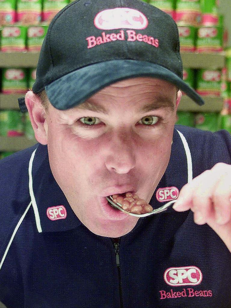 Warnie tucks into some baked beans.