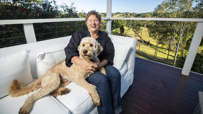 Air BnB Host Libby Murphy with Wally the Groodle at her property 'Studio the Hills' in Cooroy, Noosa Hinterland. Picture: Lachie Millard