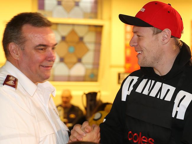 The Salvation Army’s Brendan Nottle with Collingwood star Jordan De Goey at Magpie Nest Cafe in Bourke St. Picture: Michael Klein