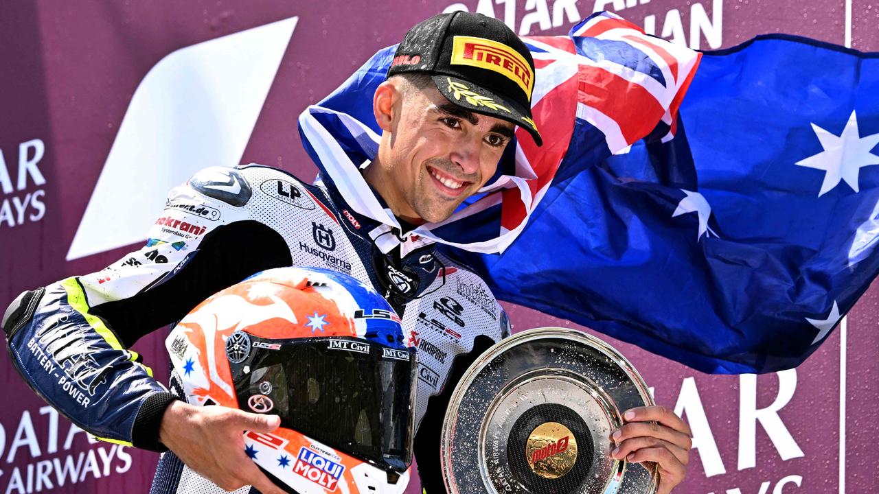 Liqui Moly Husqvarna Intact GP team rider Senna Agius of Australia celebrates his third place in the Moto2 race at the MotoGP Australian Grand Prix on Philip Island on October 20, 2024. (Photo by William WEST / AFP) / -- IMAGE RESTRICTED TO EDITORIAL USE - STRICTLY NO COMMERCIAL USE --