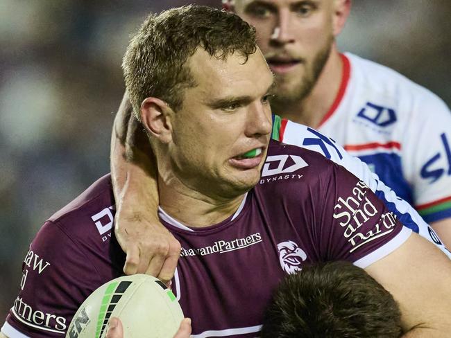 SYDNEY, AUSTRALIA - AUGUST 16: Tom Trbojevic of the Sea Eagles is tackled during the round 24 NRL match between Manly Sea Eagles and New Zealand Warriors at 4 Pines Park, on August 16, 2024, in Sydney, Australia. (Photo by Brett Hemmings/Getty Images)