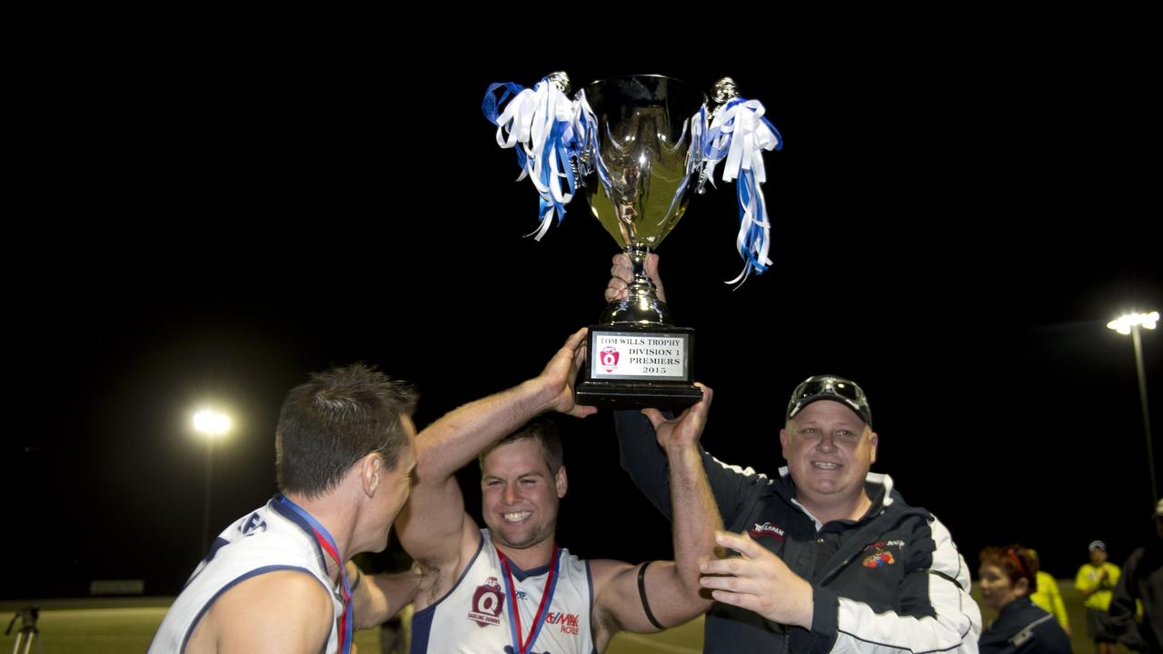 Tom Rudolph and coach Shaun Johnson celebrate their win in the 2015 AFLDD Grand Final. Photo Nev Madsen