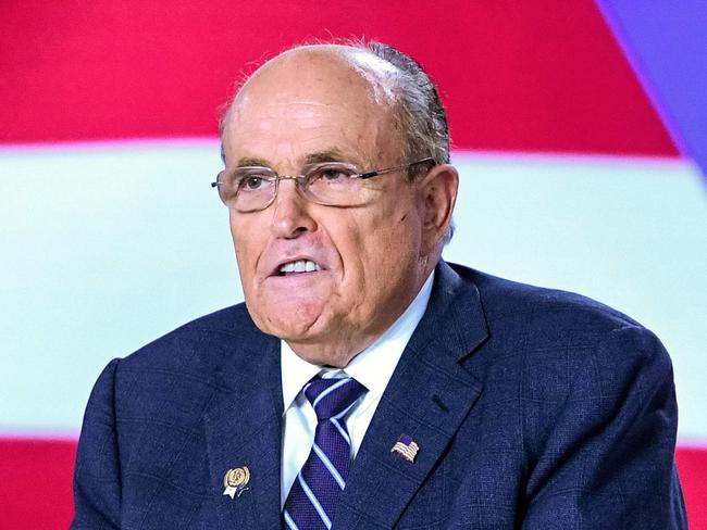 (FILES) In this file photo taken on July 13, 2019, former Mayor of New York City Rudy Giuliani speaks during a conference in Manza, Albania. - President Donald Trump's personal lawyer Rudy Giuliani returned to Ukraine on December 4, 2019, shrugging off the scandal over seeking dirt from Kiev on rival Democrats. The New York Times said Giuliani had traveled to Budapest on Tuesday and Kiev Wednesday to speak with former Ukrainian prosecutors who could have information that would support Trump's battle against impeachment. (Photo by Gent SHKULLAKU / AFP)