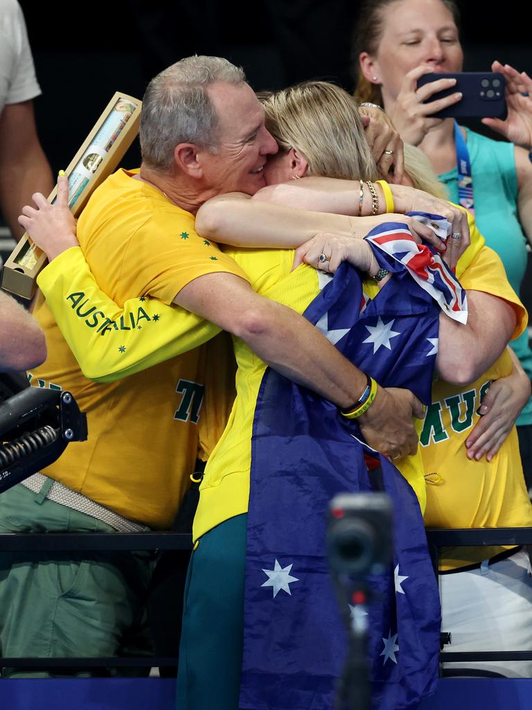 Ariarne Titmus hugs her parents after winning gold. Picture: Adam Head