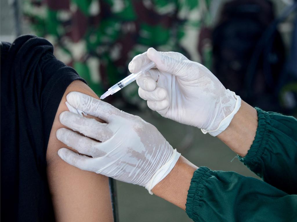 Some sectors are within their rights to require workers be vaccinated. Picture: Sonny Tumbelaka/AFP