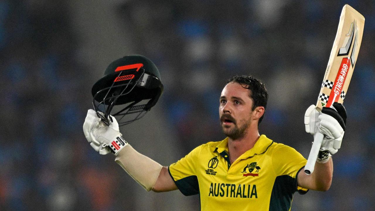 Travis Head celebrates after scoring a century. (Photo by Money SHARMA / AFP)