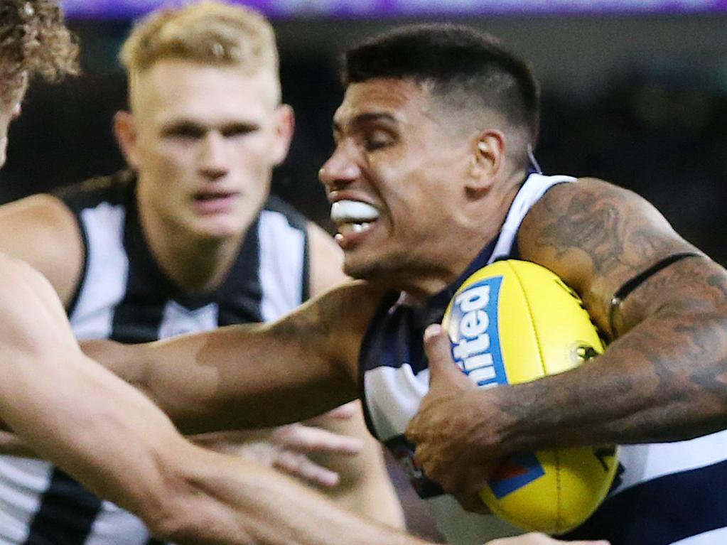 AFL Round 1. 22/03/2019. Collingwood vs Geelong at the MCG.  Tim Kelly of the Cats pushes away Chris Mayne of the Magpies  4th qtr  . Pic: Michael Klein.