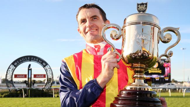 Dwayne Dunn shows the spoils of victory at Eagle Farm on Saturday. Picture: Jono Searle