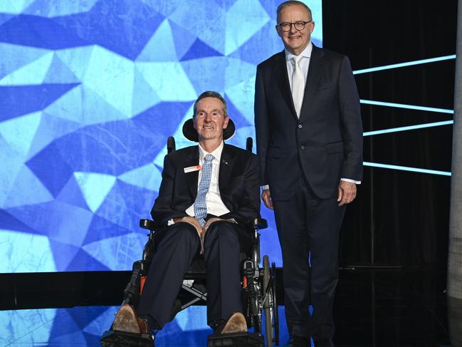 Neale Daniher, with Prime Minister Anthony Albanese, accepts his Australian of the Year award. Picture: Martin Ollman