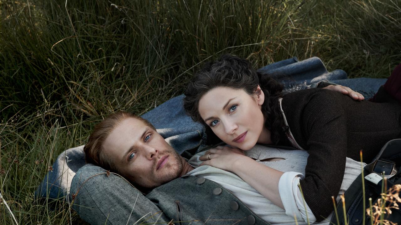 Dream laird … Sam Heughan and Caitriona Balfe in a scene from Foxtel series, Outlander. Picture: Foxtel