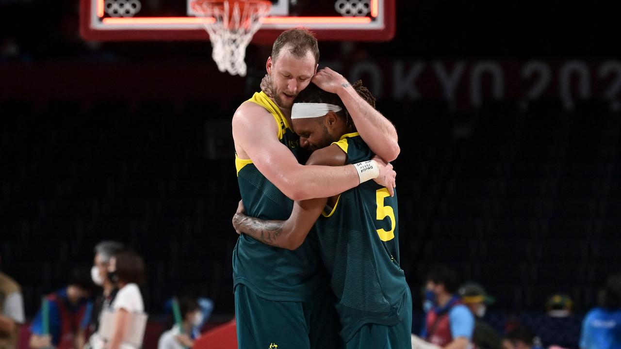 Joe Ingles and Patty Mills celebrate winning the bronze medal at the Olympics. Picture: Aris Messinis/AFP