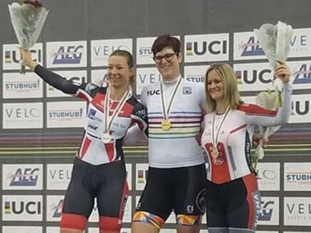 McKinnon, centre, on the podium with Jennifer Wagner-Assali, right, who says the transgender cyclist’s victory was ‘not fair’.