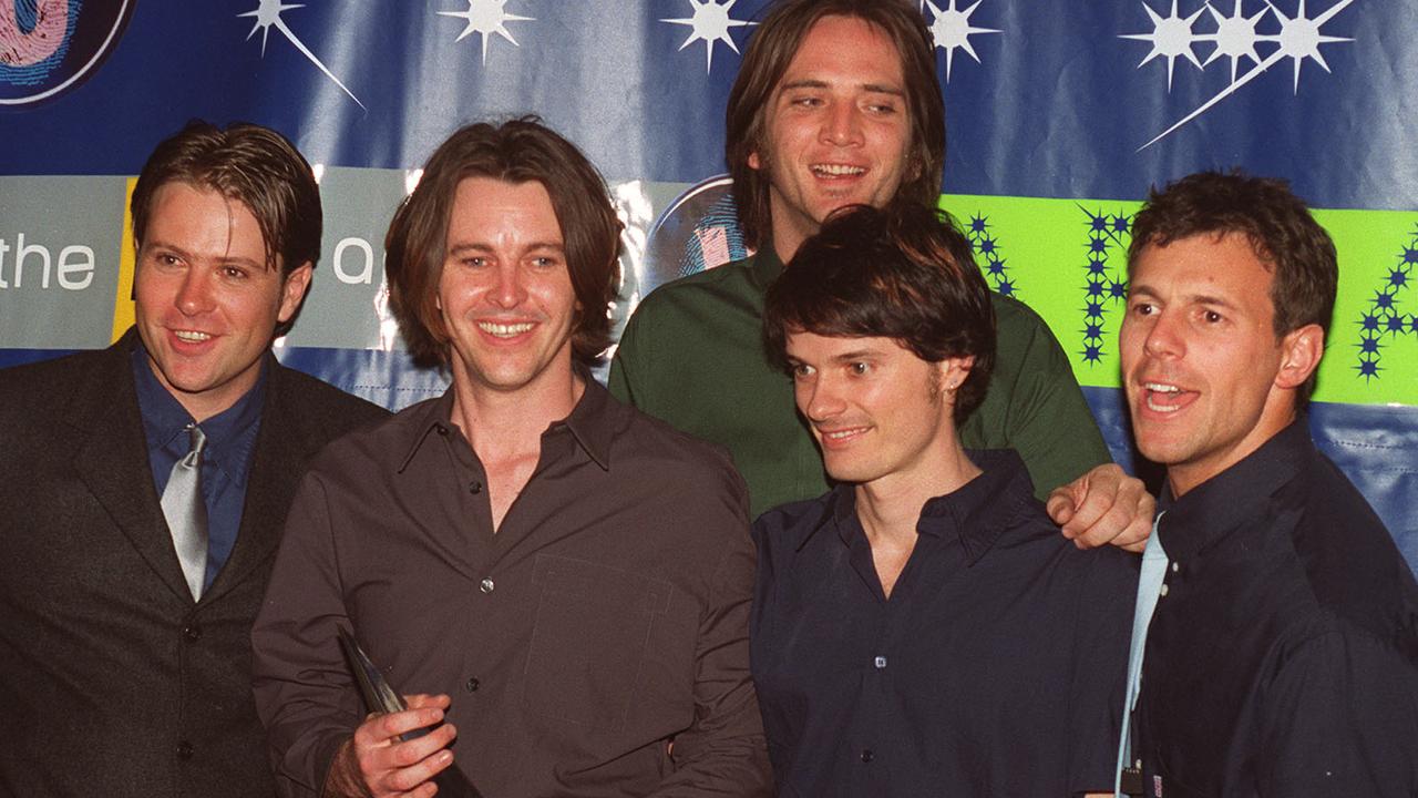 Members of band Powderfinger after collecting award at Sydney Entertainment Centre during ARIA music awards ceremony in 1999. Pic Jim Trifyllis. Powderfinger/Band