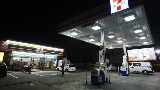 Police were called to the Enmore Rd service station after two people were allegedly attacked with an axe. Picture: Gordon McComiskie