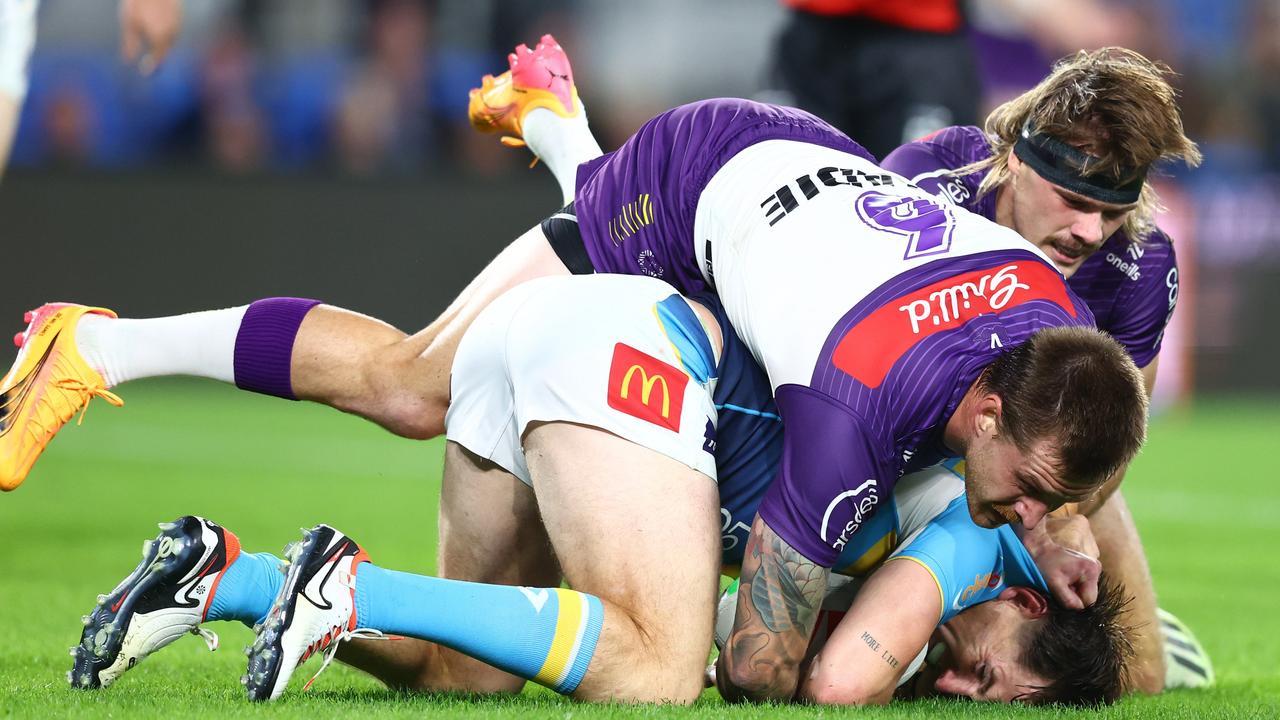 He hurt his leg in a tackle with Cam Munster and AJ Brimson. (Photo by Chris Hyde/Getty Images)