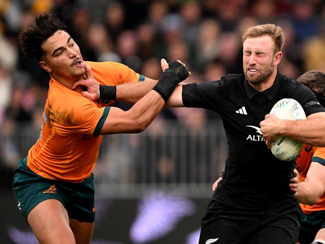 Braydon Ennor of New Zealand fends off Jordan Petaia. Picture: Joe Allison/Getty Images.