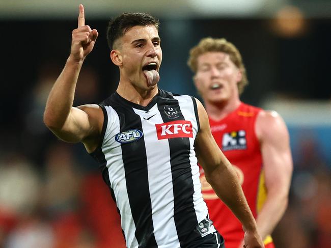 GOLD COAST, AUSTRALIA - JUNE 29: Nick Daicos of the Magpies celebrates a goal during the round 16 AFL match between Gold Coast Suns and Collingwood Magpies at People First Stadium, on June 29, 2024, in Gold Coast, Australia. (Photo by Chris Hyde/Getty Images)