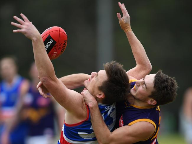 Michael ‘Zippy’ King and Connor McCafferty tussle in the grand final rematch. Picture: Andy Brownbill