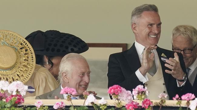 ASCOT, ENGLAND - JUNE 18: Neil Wilson, Chairman of VRC (2R) watching from the Royal Box with King Charles III delights at an Australian horse Asfoora winning The King Charles III Stakes during day one of Royal Ascot 2024 at Ascot Racecourse on June 18, 2024 in Ascot, England. (Photo by Alan Crowhurst/Getty Images for Ascot Racecourse)
