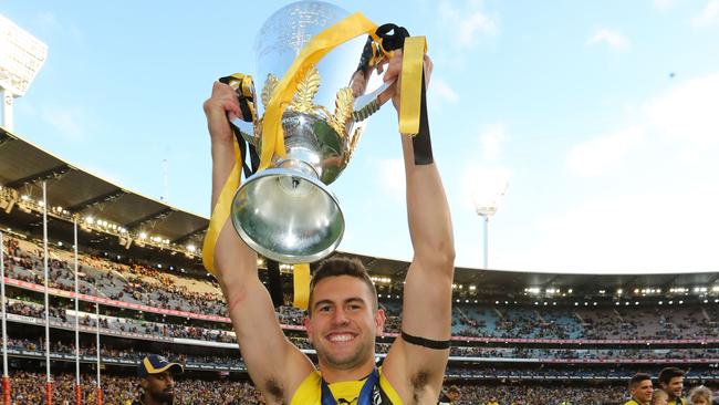 Jack Graham celebrates with the AFL premiership cup after just his fifth game. Picture: Scott Barbour/AFL Media/Getty Images