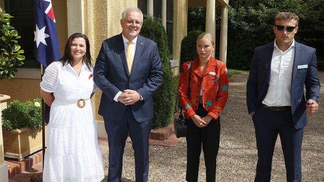 Prime Minister Scott Morrison and his wife beam as Grace Tame and her fiance stand for a picture. Picture: Gary Ramage Picture: NCA NewsWire