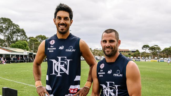 Ex-Glenelg player Terry Milera (left) pictured with former South Adelaide captain Josh Thewlis after signing at Noarlunga. Milera has now joined Marion. Picture: AAP/Morgan Sette