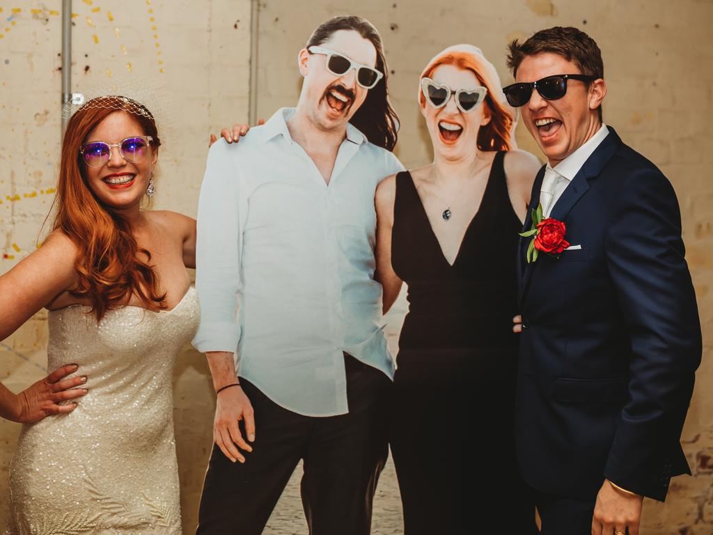 Daniel Ian Symonds and Jennifer Myfanwy Kingwell, married at Adelaide Botanic Gardens, Amber Eyes Imagery. The couple had a cardboard cutout of bride’s brother and sister-in-law, who couldn’t attend due to Melbourne lockdown, along with many other friends and family who tuned in via a livestream.