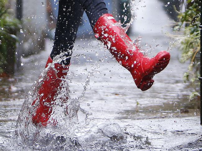 Pictured is model Amy Petrolo wearing gumboots in the rain in Surry Hills today. Hunter boots sales are up by 1000% since last year at The Iconic. Picture: Tim Hunter.