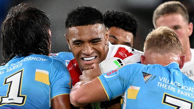 GOLD COAST, AUSTRALIA - MARCH 09: Viliami Fifita of the Dragons takes on the defence during the round one NRL match between the Gold Coast Titans and St George Illawarra Dragons at Cbus Super Stadium, on March 09, 2024, in Gold Coast, Australia. (Photo by Bradley Kanaris/Getty Images)