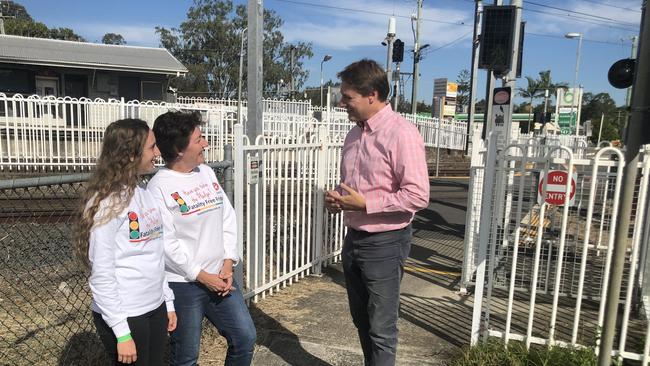 Sarah and Nyree Mannion from Make it Home Safely with Federal Member for Bonner Ross Vasta at the Lindum rail station.