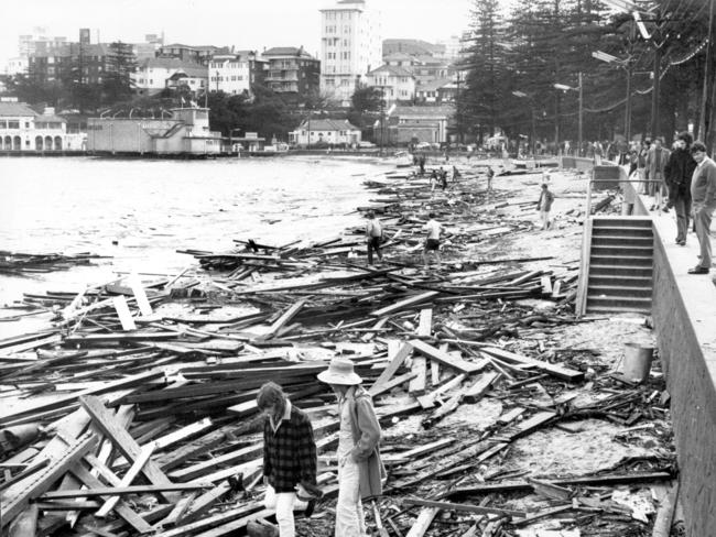 Debris from the boardwalk litters the beach at Manly Manly Cove in May, 1974. Picture: Frank Violi.