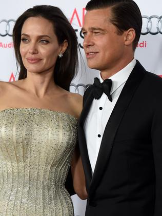 HOLLYWOOD, CA - NOVEMBER 05: Writer-director-producer-actress Angelina Jolie Pitt (L) and actor-producer Brad Pitt attend the opening night gala premiere of Universal Pictures' "By the Sea" during AFI FEST 2015 presented by Audi at TCL Chinese 6 Theatres on November 5, 2015 in Hollywood, California. Kevin Winter/Getty Images/AFP == FOR NEWSPAPERS, INTERNET, TELCOS & TELEVISION USE ONLY ==