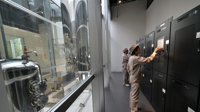 Engineers check power management units at Toshiba's hydrogen research and development centre at the company's Fuchu plant in Tokyo. Picture: AFP