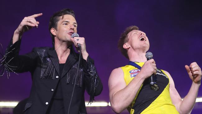 The 2017 AFL Grand Final between the Adelaide Crows and Richmond Tigers at the Melbourne Cricket Ground. The Killers lead singer Brandon Flowers with Jack Riewoldt.    Picture: Alex Coppel.