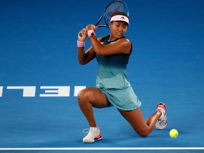 Japan's Naomi Osaka hits a return against Czech Republic's Karolina Pliskova.