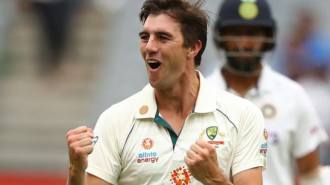 MELBOURNE, AUSTRALIA - DECEMBER 27: Pat Cummins of Australia celebrates taking the wicket of Cheteshwar Pujara of India during day two of the Second Test match between Australia and India at Melbourne Cricket Ground on December 27, 2020 in Melbourne, Australia. (Photo by Robert Cianflone/Getty Images)