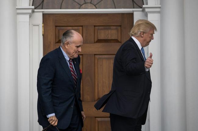 BEDMINSTER TOWNSHIP, NJ - NOVEMBER 20: (L to R) Former New York City mayor Rudy Giuliani and president-elect Donald Trump head into the clubhouse for their meeting at Trump International Golf Club, November 20, 2016 in Bedminster Township, New Jersey. Trump and his transition team are in the process of filling cabinet and other high level positions for the new administration.   Drew Angerer/Getty Images/AFP