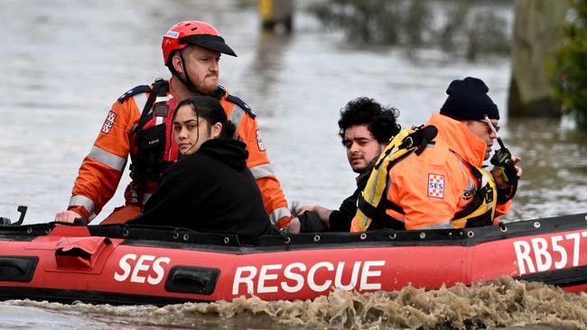 Emergency crews rescue locals in Maribyrnong. Picture: AFP