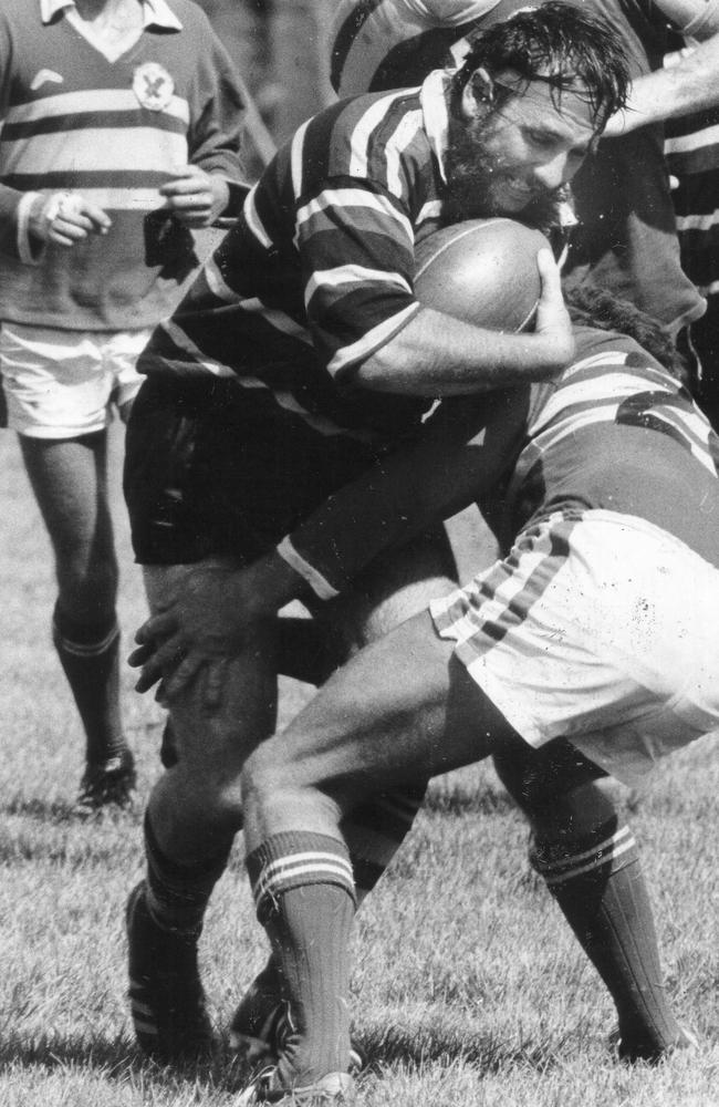 Palmerston hooker Dennis Bree is a study of grim determination as he charges into the Bayside opposition at Nightcliff Oval in 1981.