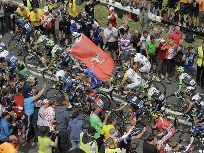 Spectators cheers as the pack passes during the second stage.