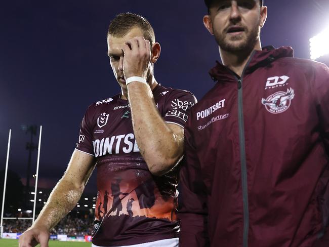 SYDNEY, AUSTRALIA - APRIL 23: Tom Trbojevic of the Sea Eagles leave the field with the trainer during the round eight NRL match between Wests Tigers and Manly Sea Eagles at Campbelltown Stadium on April 23, 2023 in Sydney, Australia. (Photo by Mark Kolbe/Getty Images)