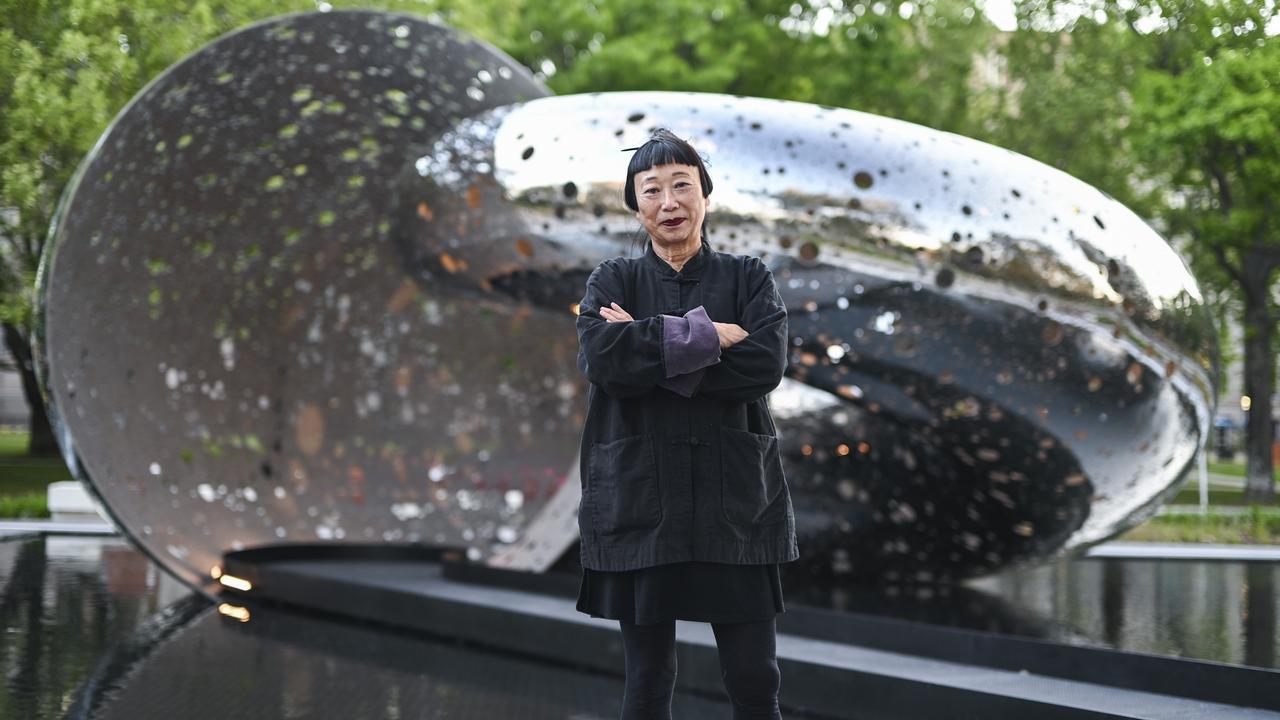 Lindy Lee with her sculpture Ouroboros