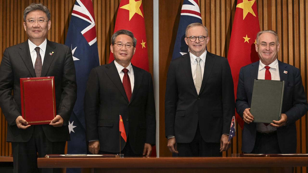 Senator Don Farrell, far right, signs MOU documents along with Chinese Premier Li Qiang and Prime Minister Anthony Albanese at Parliament House in Canberra. Picture: NewsWire / Martin Ollman