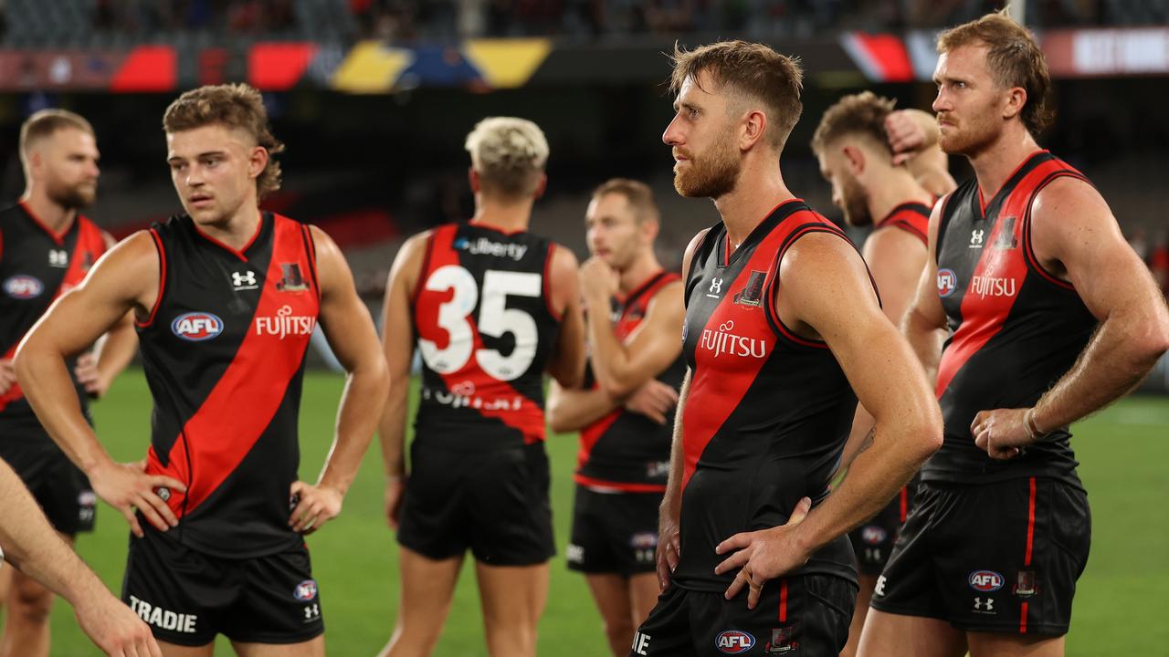 MELBOURNE, AUSTRALIA - MARCH 26: The Bombers look dejected after they were defeated by the Lions during the round two AFL match between the Essendon Bombers and the Brisbane Lions at Marvel Stadium on March 26, 2022 in Melbourne, Australia. (Photo by Robert Cianflone/AFL Photos/via Getty Images)