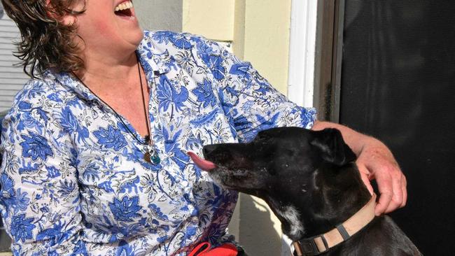 WOMAN&#39;S BEST FRIEND: Lee McGregor shares a laugh with her dog, Darkie. Picture: Matt Collins